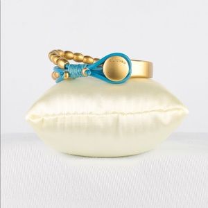 Pulccino designer gold tone and turquoise statement bracelet.